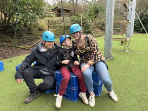 A family enjoying the assault course