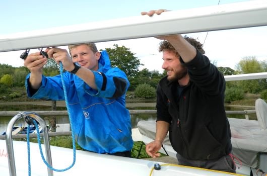 Instructor leading an outdoor training session with a group of delegates