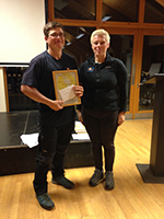 Ted Downey receives his award for excellent customer service in his outdoor learning activities